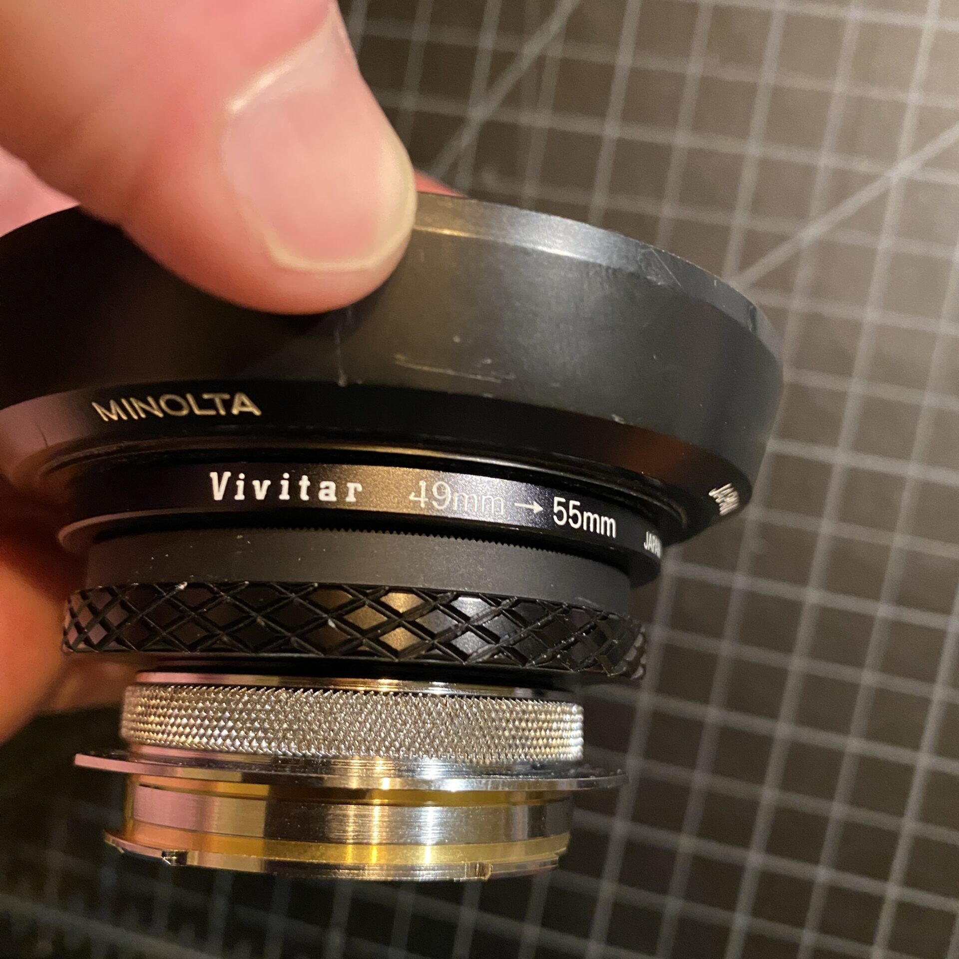 A photo of a lens with a lens hood
